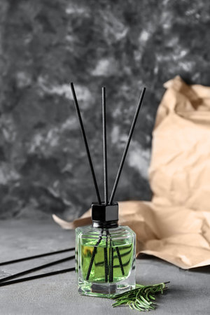 Reed diffuser with rosemary on grunge backgroundの写真素材