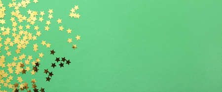 Beautiful confetti on green background with space for text