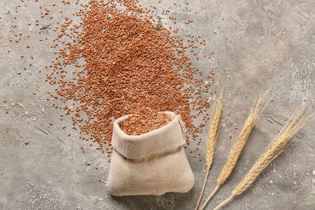 Bag with flax seeds on gray backgroundの写真素材
