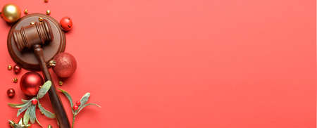 Judge's gavel and Christmas decor on color background with space for textの写真素材