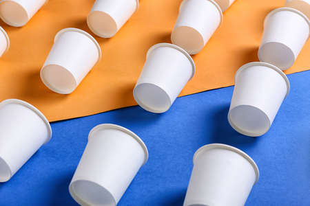 Blank paper cups on color background, closeupの写真素材