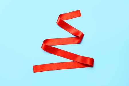 Red ribbon on color backgroundの写真素材