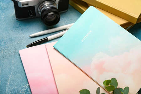 Different notebooks on color background, closeupの写真素材