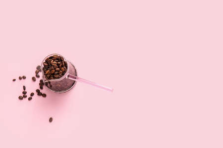 Cezve with coffee beans on color backgroundの写真素材