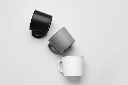 Empty cups on light backgroundの写真素材