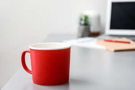 Cup of tea on office tableの写真素材