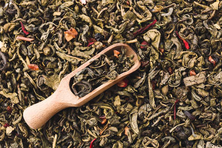 Scoop on dry green tea, closeupの写真素材