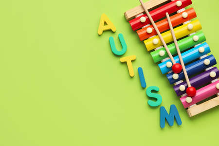Word AUTISM and xylophone on color backgroundの写真素材