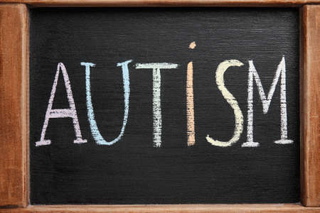 Chalk board with word AUTISM, closeupの写真素材