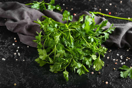 Fresh parsley with spices on dark backgroundの写真素材