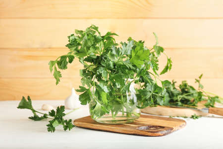 Jar of fresh parsley on light backgroundの写真素材