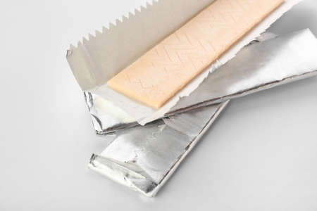 Tasty chewing gums on white background