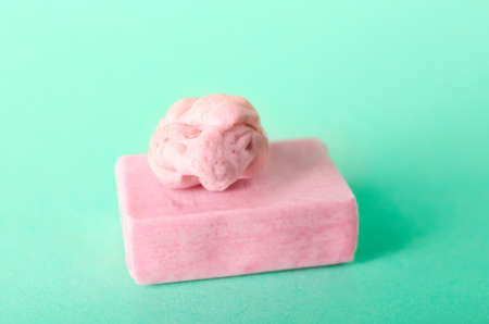 Tasty chewing gum on color background