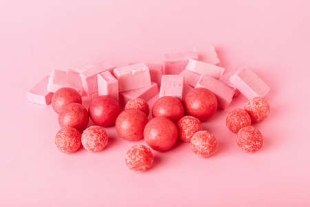 Tasty chewing gums on color background