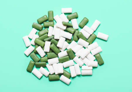 Tasty chewing gums on color backgroundの写真素材