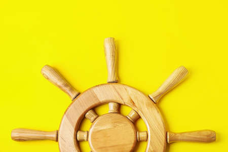 Ship helm on color backgroundの写真素材