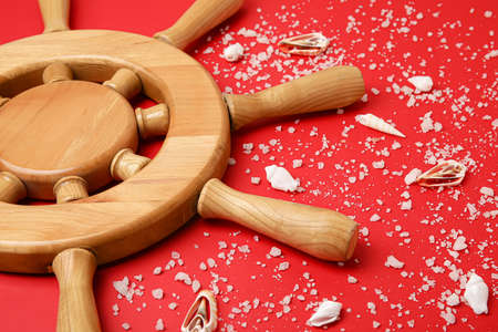 Helm and sea shells on color backgroundの写真素材