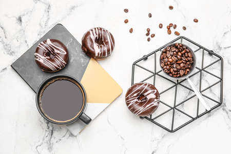 Composition with cup of coffee and donuts on marble backgroundの写真素材