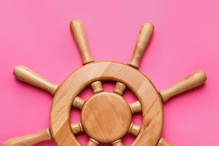 Ship helm on color backgroundの写真素材