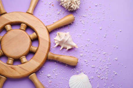 Helm and sea shells on color backgroundの写真素材