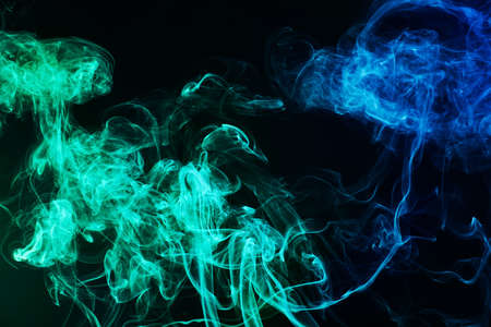 Color smoke on dark backgroundの写真素材