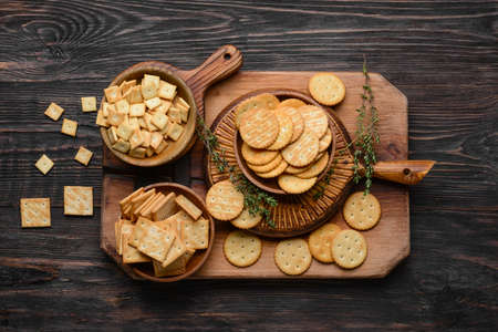Composition with crackers on wooden backgroundの写真素材