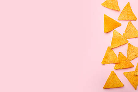 Tasty nachos on color backgroundの写真素材