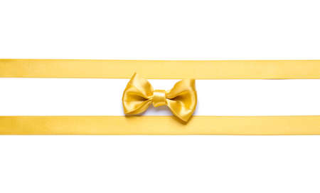 Beautiful golden ribbons with bow on white background