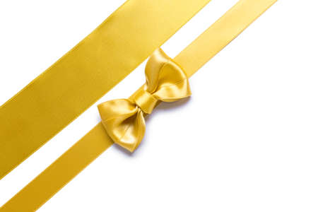 Beautiful golden ribbons with bow on white backgroundの写真素材