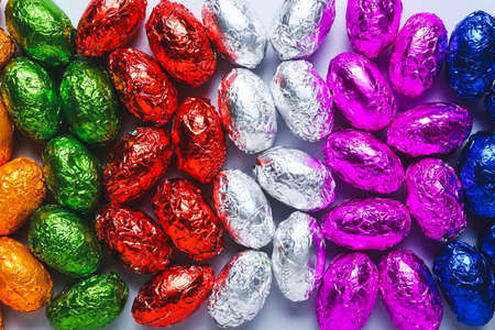 Many chocolate Easter eggs as backgroundの写真素材