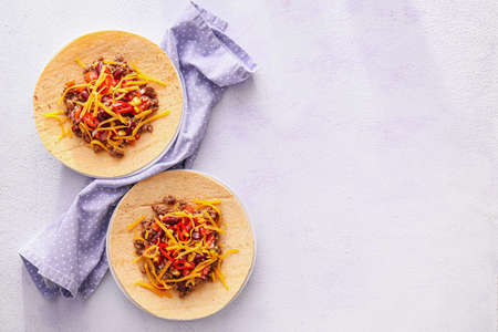 Plates with tasty tacos on color backgroundの写真素材