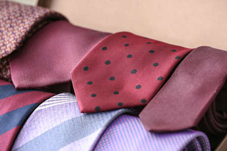 Box with many stylish neckties, closeupの写真素材