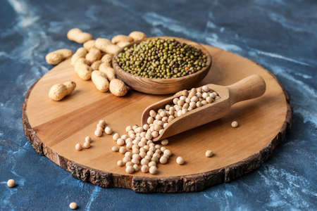 Composition with different legumes on color background