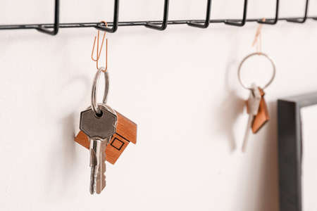 Key holder hanging on light wall, closeupの写真素材