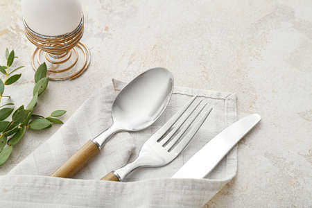 Beautiful table setting for Easter celebration on gray background