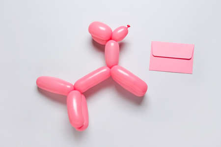 Balloon dog and letter on gray backgroundの写真素材