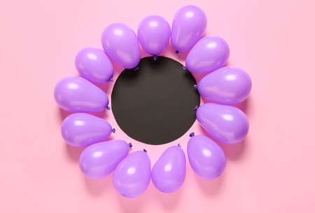 Blank card and air balloons on color backgroundの写真素材