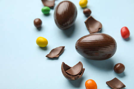 Chocolate Easter eggs on color background