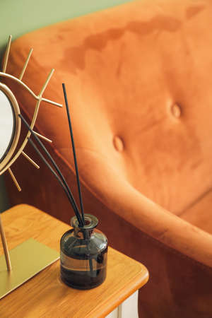 Reed diffuser on table in roomの写真素材