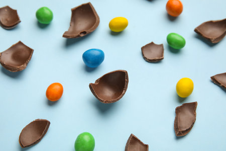 Composition with chocolate Easter eggs on color backgroundの写真素材