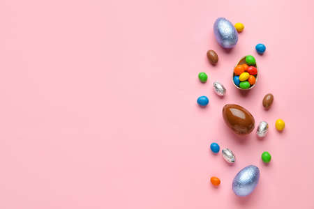 Chocolate Easter eggs on color background