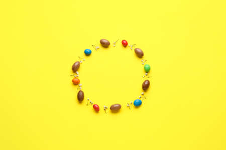 Composition with chocolate Easter eggs on color backgroundの写真素材