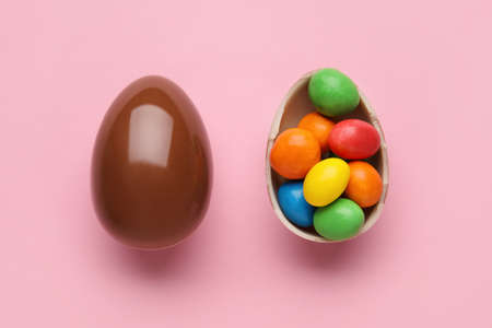 Chocolate Easter eggs on color backgroundの写真素材