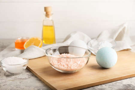 Board with ingredients for homemade cosmetics on grunge background