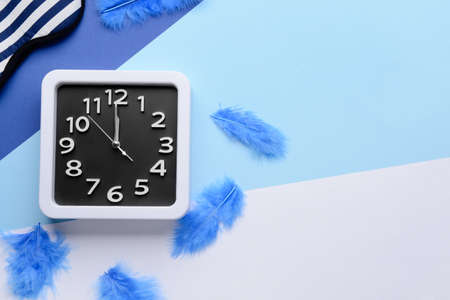 Composition with stylish clock on color backgroundの写真素材
