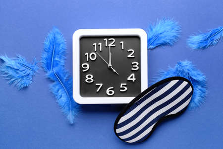 Composition with stylish clock on color background