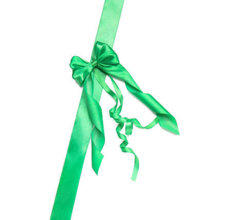 Beautiful green ribbon with bow on white backgroundの写真素材