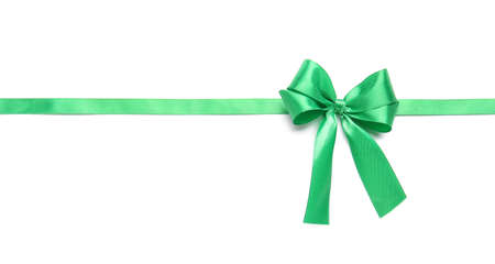 Beautiful green ribbon with bow on white backgroundの写真素材