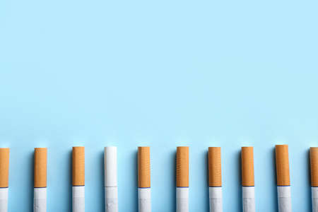 Many cigarettes on color background