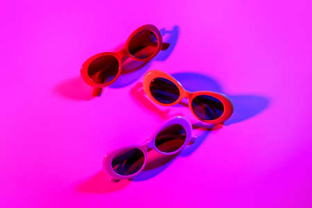 Stylish sunglasses on color backgroundの写真素材